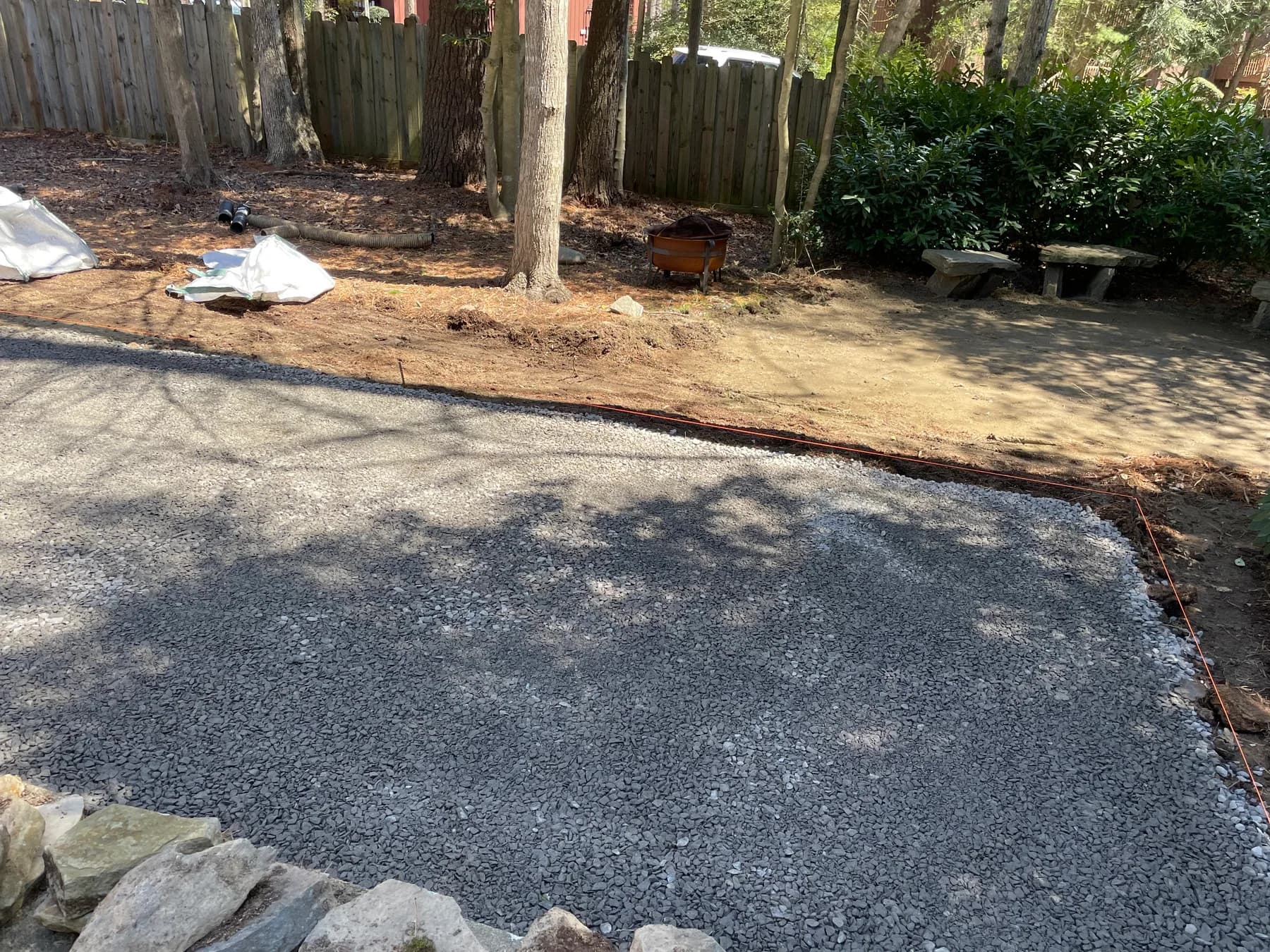 Woodland stone patio project with stone surfacing, border work, and outdoor seating area, view 2