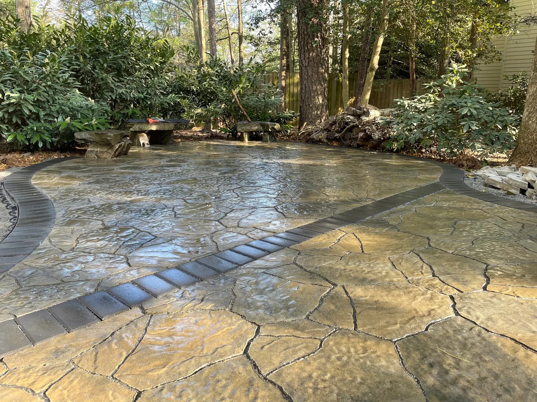 Woodland stone patio project with stone surfacing, border work, and outdoor seating area, view 12